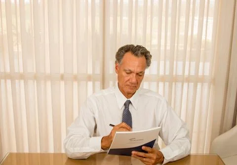 Man Working at his Desk Stock Photos