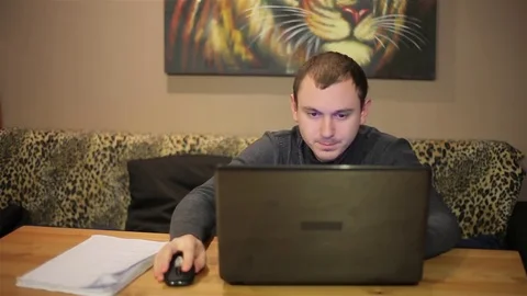 Man working at his laptop Stock Footage 72379957