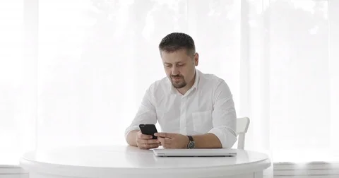 Man working on his laptop at home. Stock Footage 78693025
