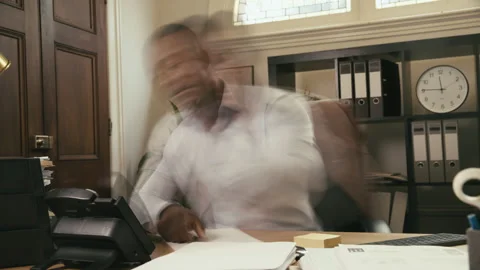 Man working in his office on some paperwork Stock Footage 264320769