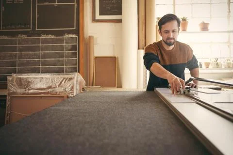 Man working at his workbench with concentration Stock Photos