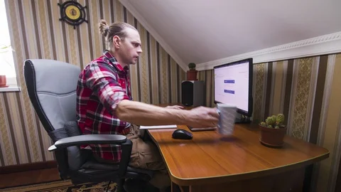 Man working at home on the computer. Timelapse. Stock Footage 127897310