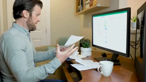 Man working from home on desktop computer bored tired and stressed with Stock-Footage 152887931