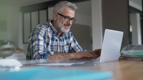 Man working from home on laptop computer Stock Footage 124066389