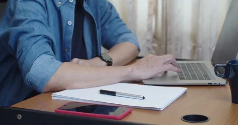 Man working from home with laptop computer with moody Stock Footage 129601191