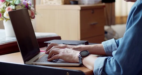 Man working from home with laptop computer with moody Stock Footage 129601519