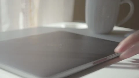Man working from home on laptop drinking coffee Stock Footage 151469697