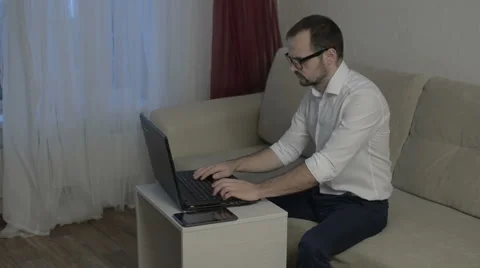 Man working from home with laptop Stock Footage 58098715