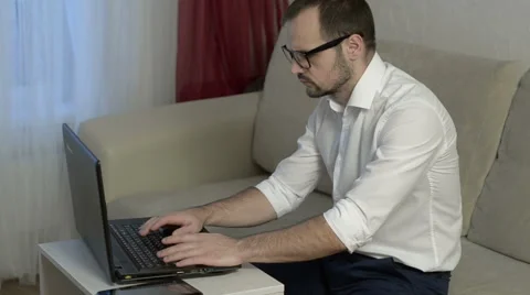Man working from home with laptop Stock Footage 58099198