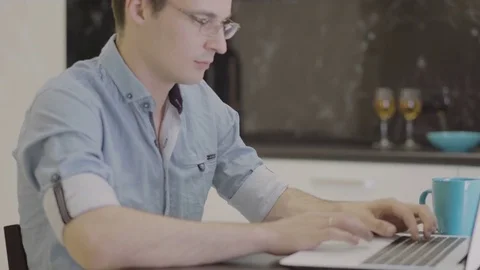 Man working at home on a laptop Stock Footage 80845964