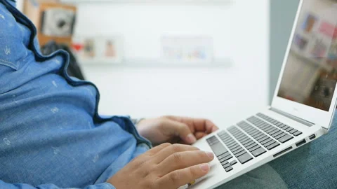 Man working from home on a laptop Stock Footage 92335888