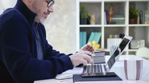 Man working at home with laptop Video stock 149202257
