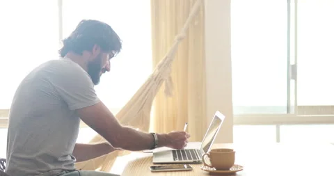 Man working at home with laptop Stock Footage 171483440