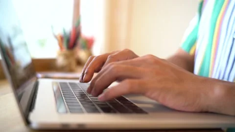 Man working at home office hand on keyboard close up searching web Stock Footage 137645963