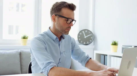 Man working from home office on laptop Stock Footage