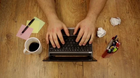 Man working at home office, typing on a laptop, top view Stock Footage 72174387