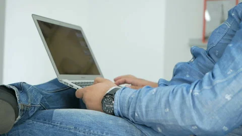 Man working from home studio on a laptop Video stock 98488423