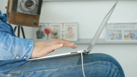 Man working from home studio on a laptop Video stock 98488875