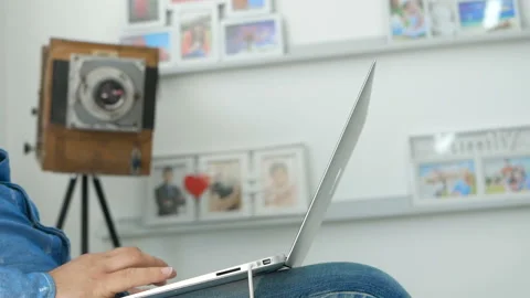 Man working from home studio on a laptop Stock Footage 98489028