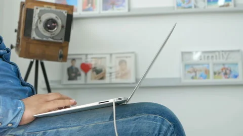 Man working from home studio on a laptop Video stock 98489207