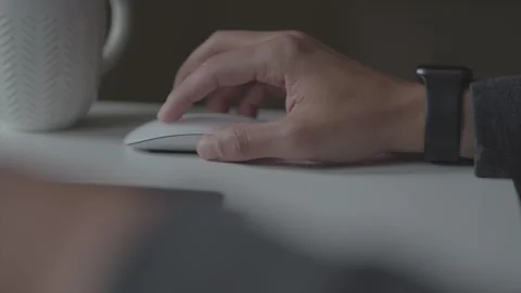 Man working from home typing on laptop and using mouse Stock Footage 151469710