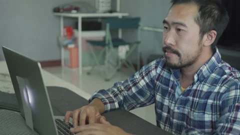A man working from home use laptop in the bed room Stock Footage 146589256
