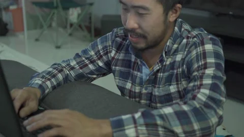 A man working from home use laptop in home on bed Stock Footage 146589485
