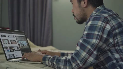A man working from home use laptop in home Stock Footage 146591737