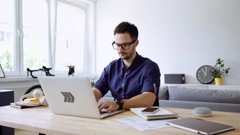Man working at home using laptop Stock Footage 146899020