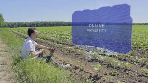 Man is working on HUD with text Online university Stock Footage 107273163