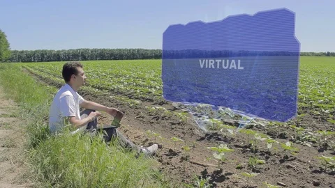 Man is working on HUD with text Virtual Stock Footage 106986895