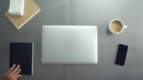 Man working indoors with notebook drinking coffee Stock Footage 87250541