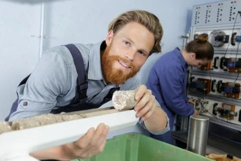 A man working on insulation Stock Photos