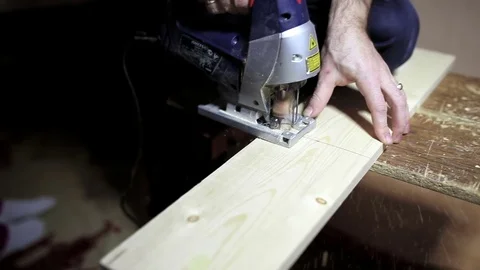 Man working with a jigsaw Stock Footage 69932729