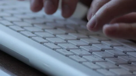 Man is working on the keyboard of Apple iMac Slim Stock Footage 48128406