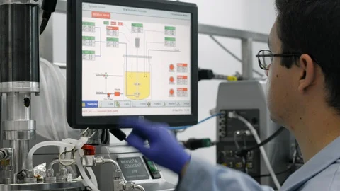 Man working in a lab with a touch screen Stock Footage 96184490