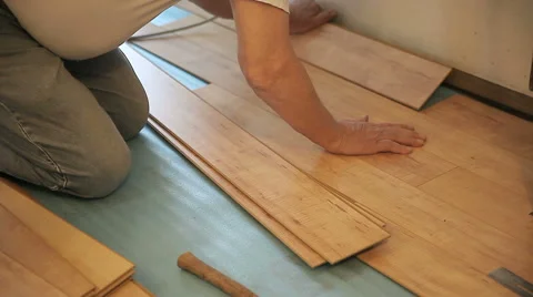 Man working on laminate floor Stock Footage 44149461