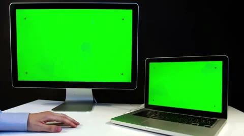 Man Working on the Laptop and Display with a Green Screen  at the Workplace. Видео 52108252
