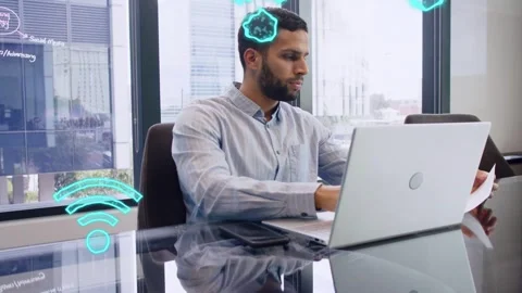 Man working laptop and scanning documents in tech room while emerging Wi?Fi Stock Footage 333689156