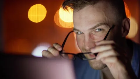 Man working on laptop and smiling at camera Stock Footage 131538532