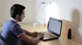 man working at the laptop and surfing in internet HD Footage