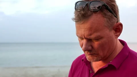 Man working with a laptop by the beach Close Stock Footage 132902456