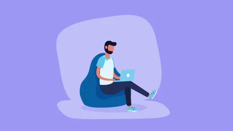 Man working on laptop on bean bag chair computer freelance Stock Footage 320782856
