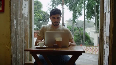 Man working on laptop in cafe Stock Footage 80118847
