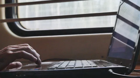 Man working on laptop in the car at the window Stock Footage 63319403