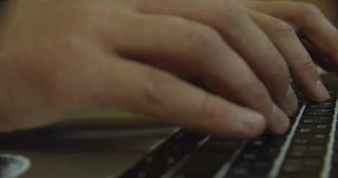 Man working on a laptop, close-up of hands on the keyboard Stock Footage 113284681