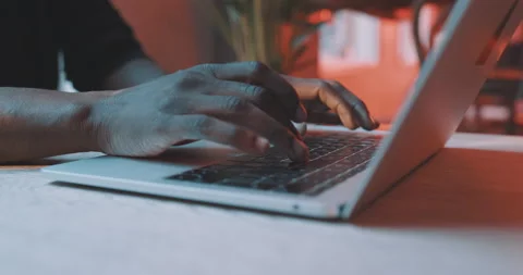 Man working on a laptop closeup Stock Footage 203581221