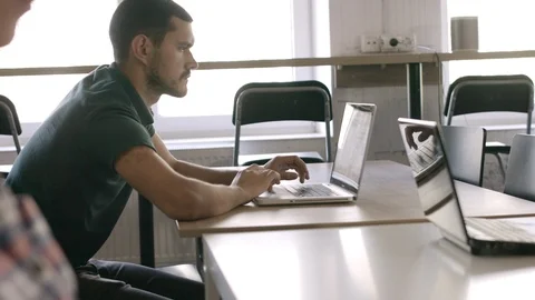 Man working on the laptop in co-working. Stock Footage 90173082