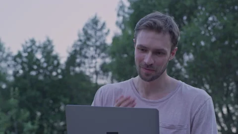 A man is working on a laptop. Communicate. Laptop. Freelancer. Stock Footage 157404688