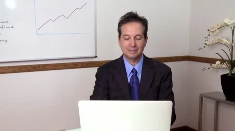 Man working at a laptop computer Stock Footage 40844399